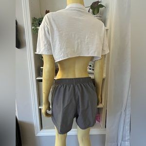 I am selling gray Nike shorts. It has built in underwear and can adjust.